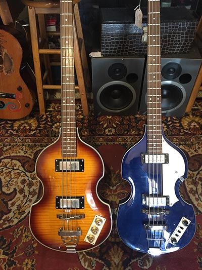 photo of two bass guitars