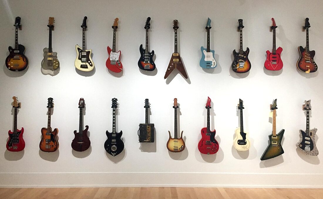 photo of guitars in museum exhibit